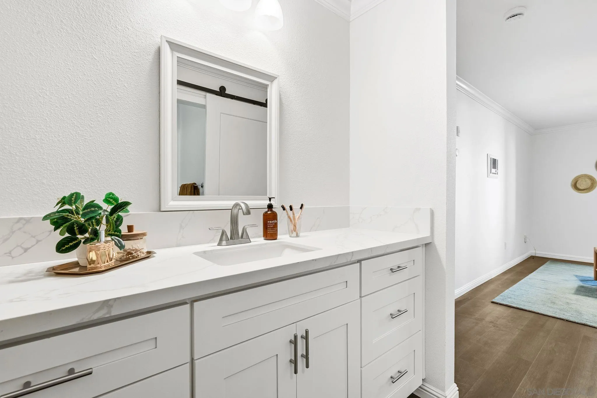 10226 Black Mountain Road, Unit 83 San Diego, CA 92126 - Photo 16 of 23 a bathroom with a sink and a mirror