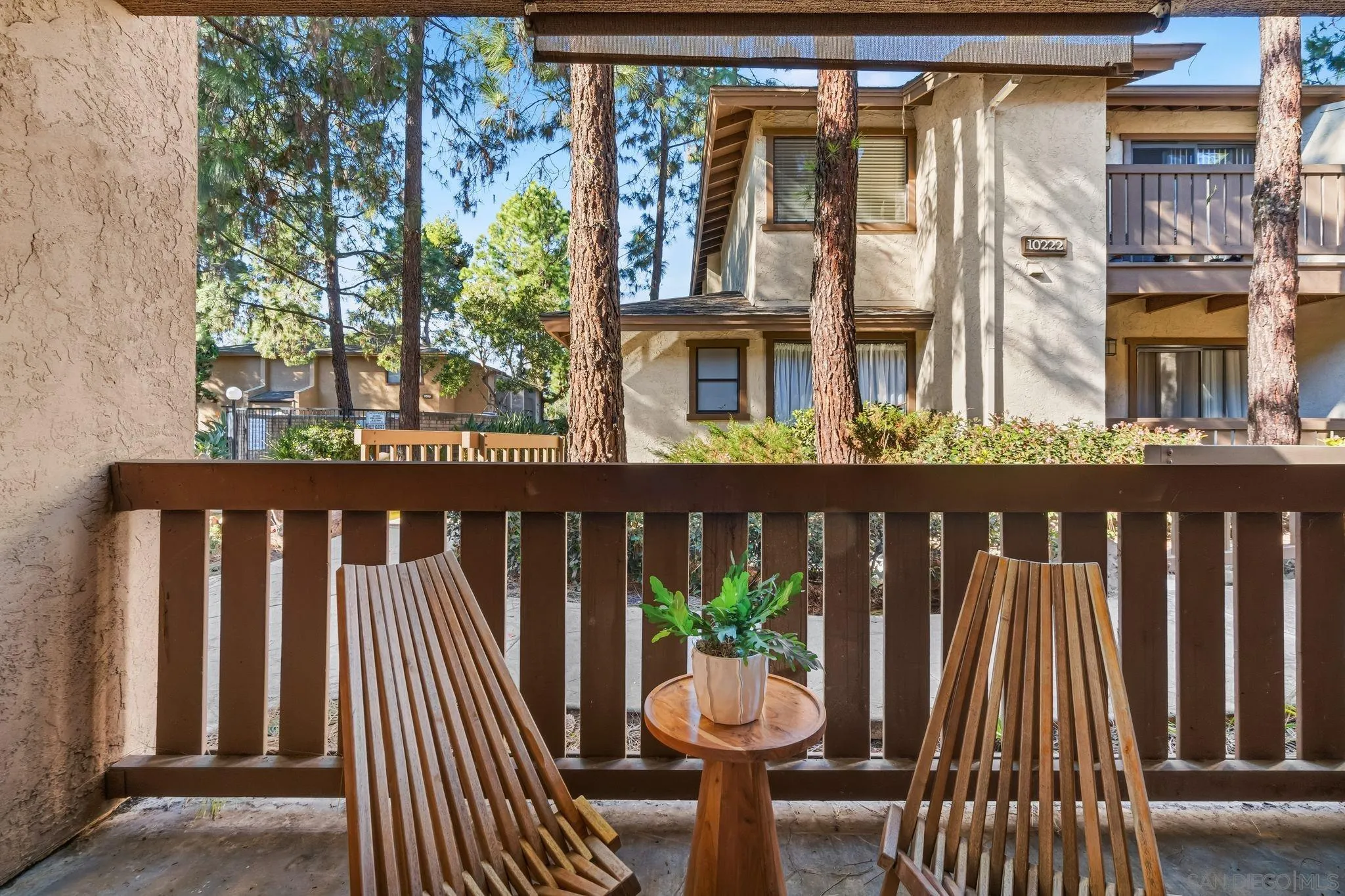 10226 Black Mountain Road, Unit 83 San Diego, CA 92126 - Photo 17 of 23 a view of a two chairs and table in the balcony