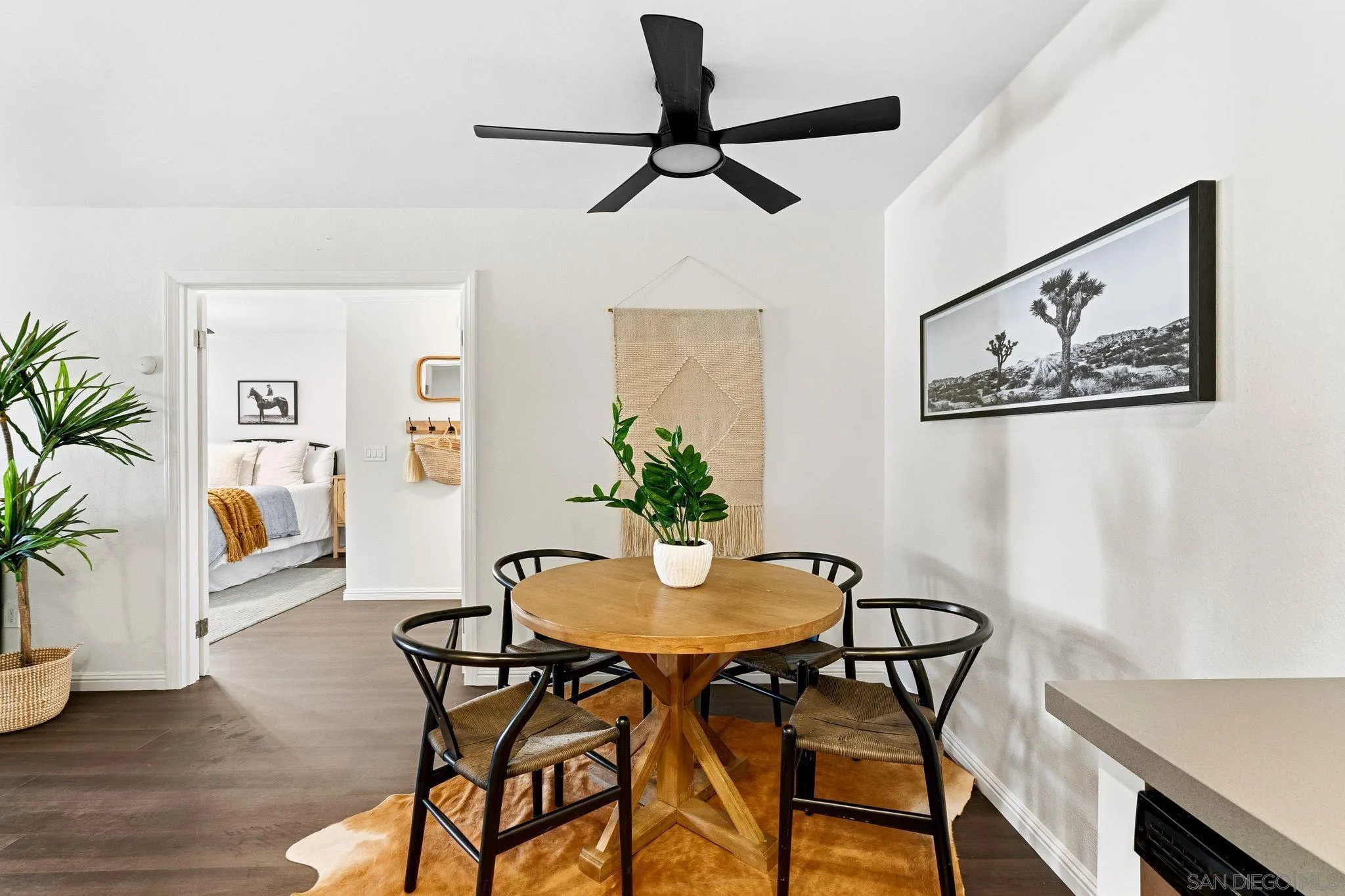 10226 Black Mountain Road, Unit 83 San Diego, CA 92126 - Photo 8 of 23 a view of a dining room with furniture and a potted plant