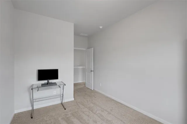 a living room with a flat screen tv