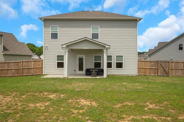 a view of a house with a yard