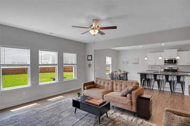 a living room with furniture and a window