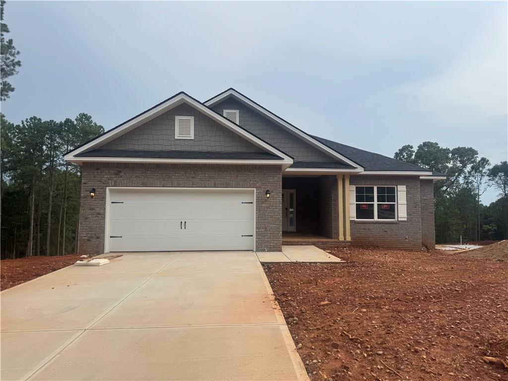 22 Crab Orchard Way Pendergrass, GA 30567 - Photo 1 of 1 a front view of a house with a yard and garage