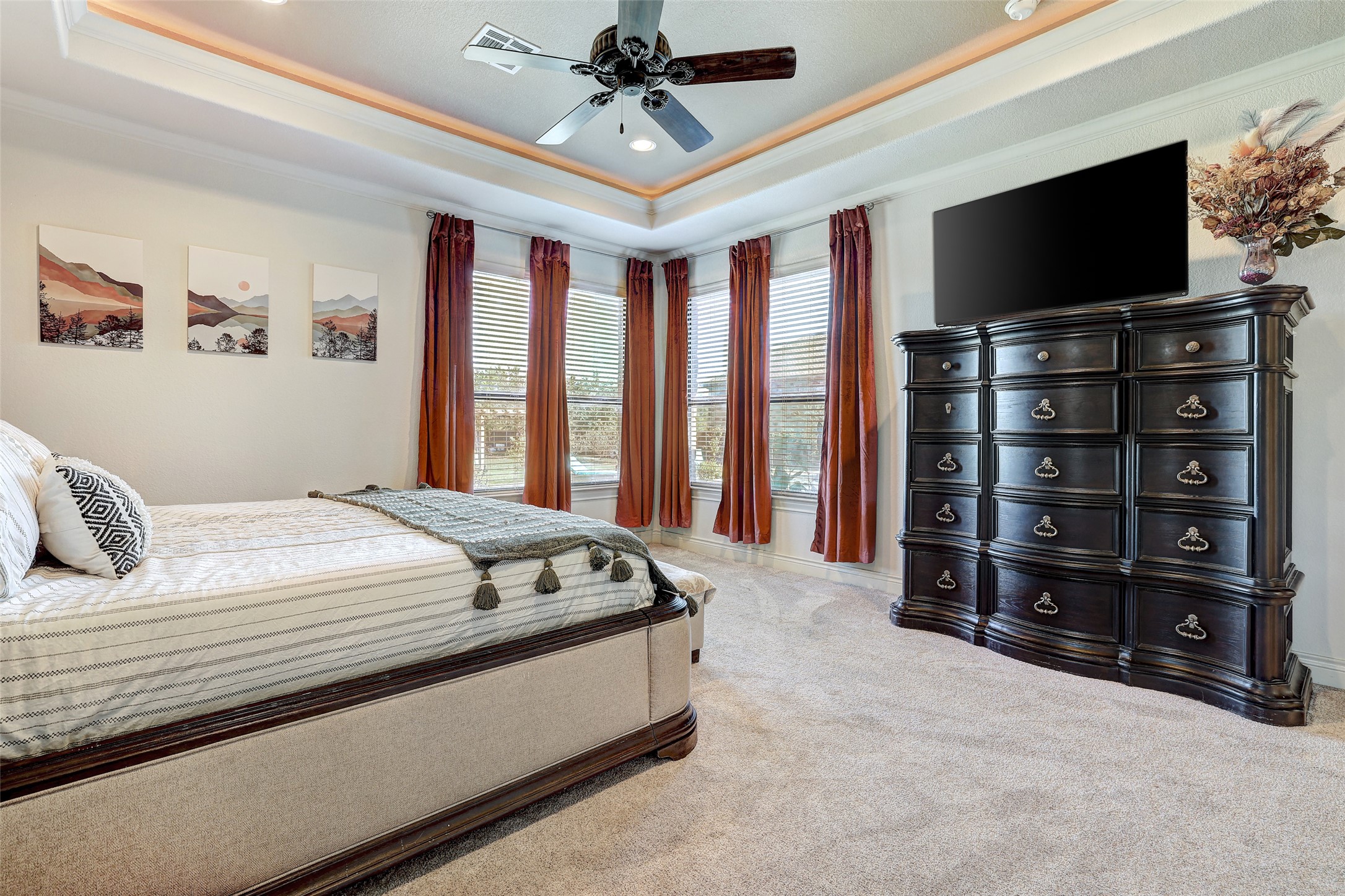 Undisclosed Address Georgetown, TX 78633 - Photo 22 of 39 Bedroom featuring crown molding, ceiling fan, carpet flooring, a raised ceiling, and recessed lighting