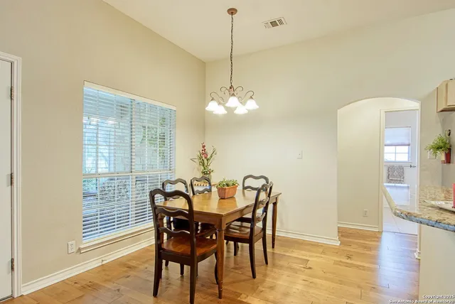 a kitchen with stainless steel appliances granite countertop a sink and cabinets