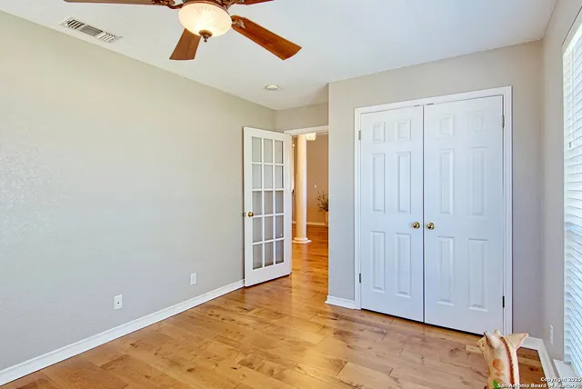 a work room with furniture and a window
