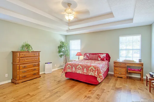 a bedroom with furniture and a chandelier