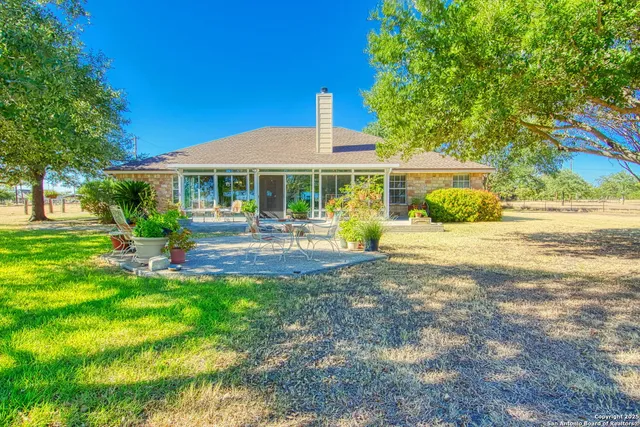 a view of a house with a big yard