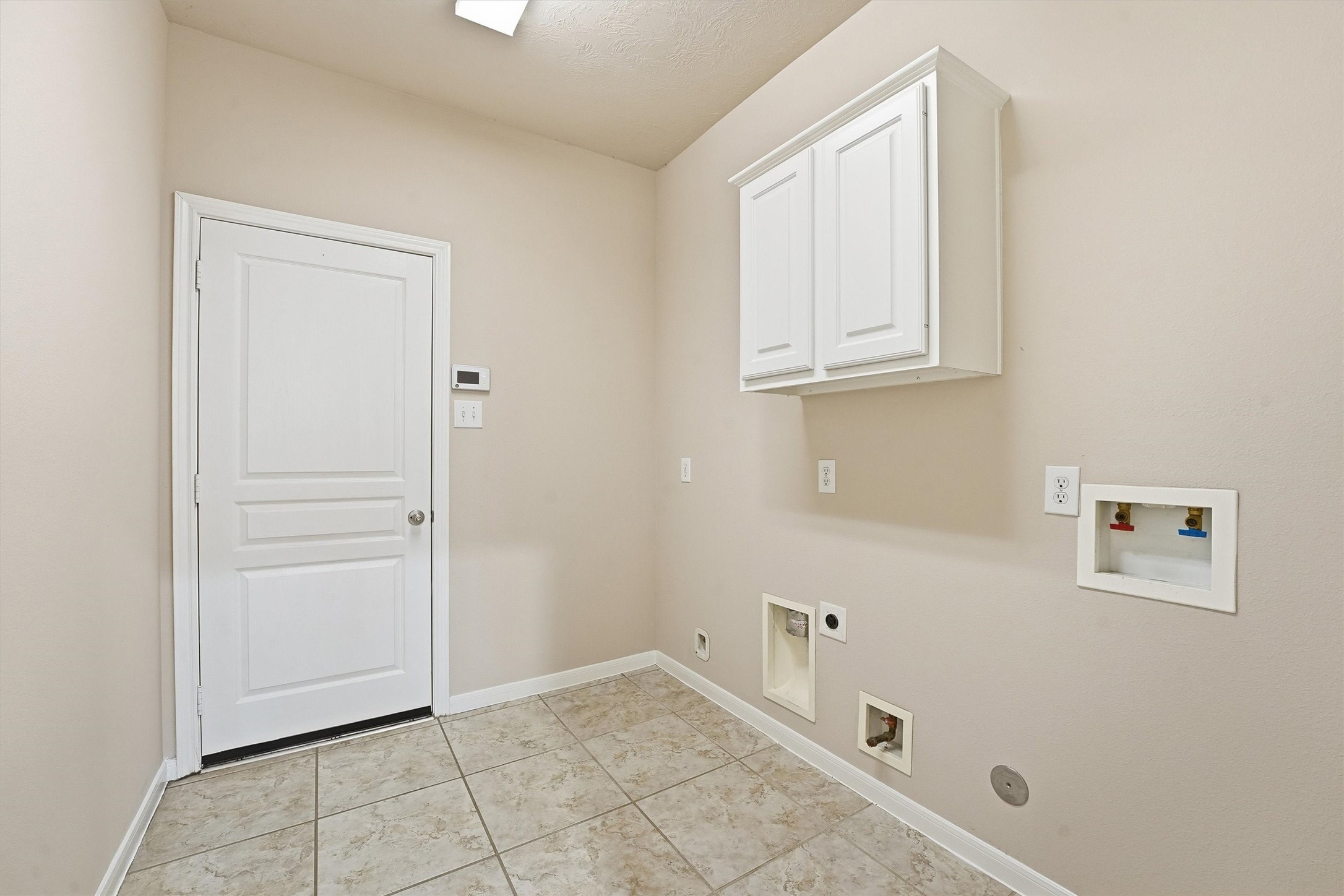 17415 Memorial Mills Drive Spring, TX 77379 - Photo 31 of 37 Large, dedicated laundry room with built-in cabinetry and washer/dryer connections.