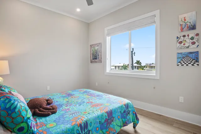 a view of a golf ground with large trees
