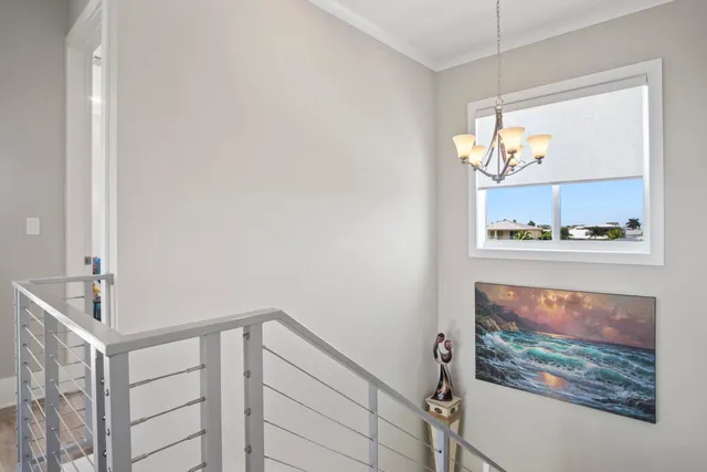 a view of a swimming pool with lawn chairs