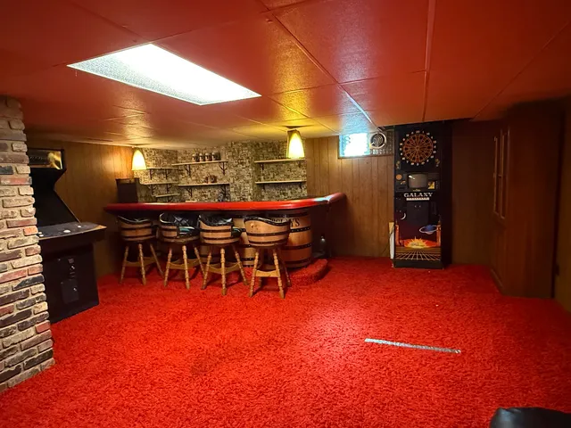 a view of a patio with dining table and chairs