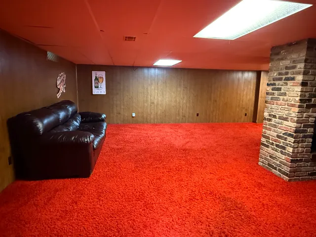 a bed room with a bed and a night stand