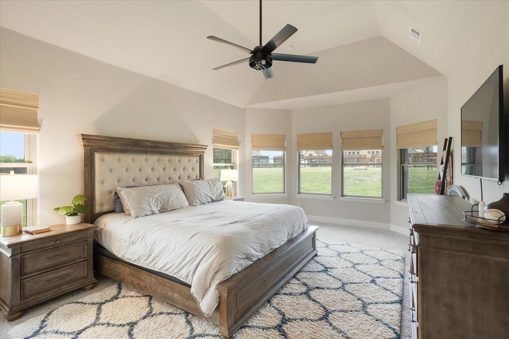 1205 Redbud Street Howe, TX 75459 - Photo 12 of 40 a bedroom with a large bed and a large window
