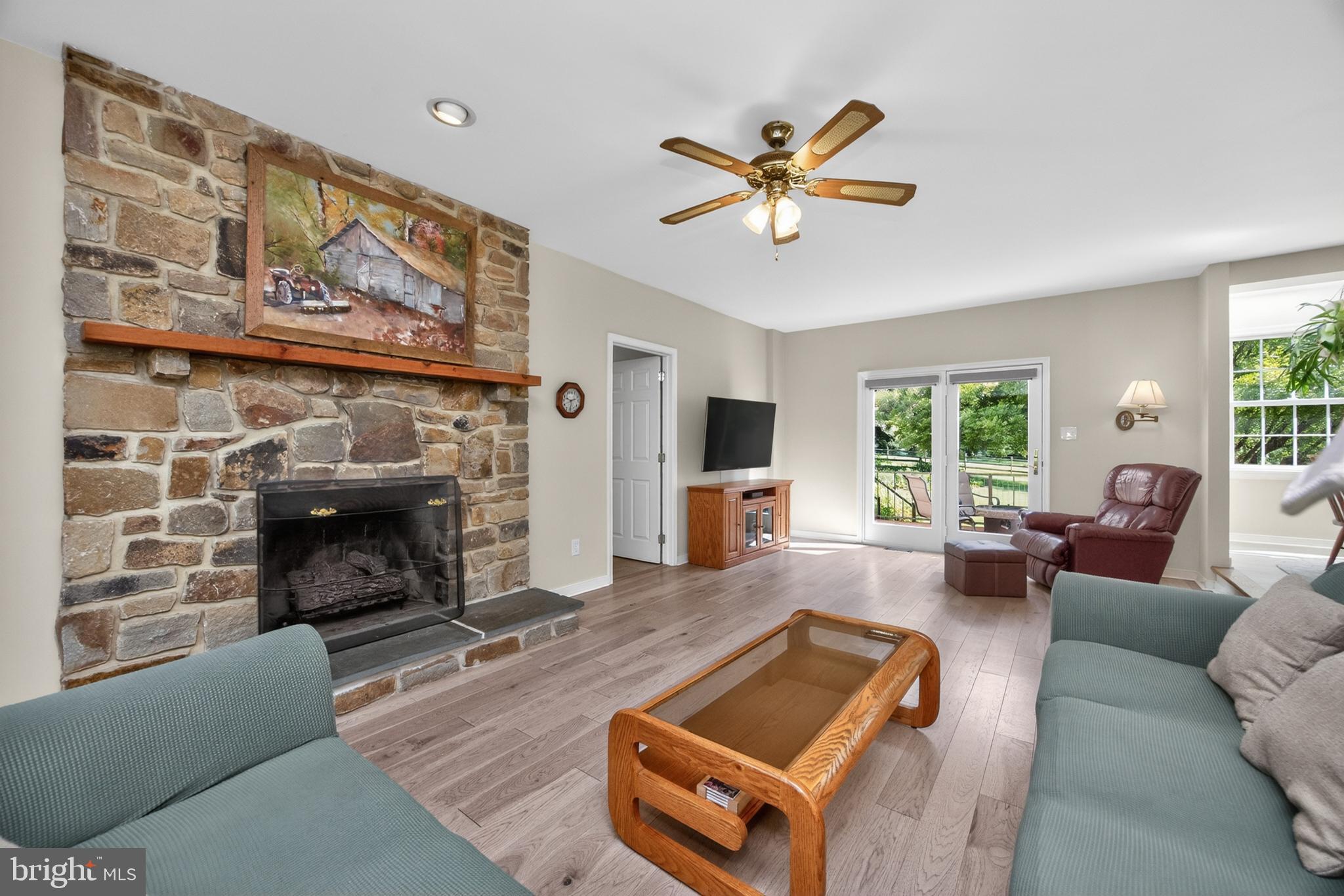 153 East Doe Run Road Kennett Square, PA 19348 - Photo 13 of 76 Family room off of kitchen with stone mantle firep