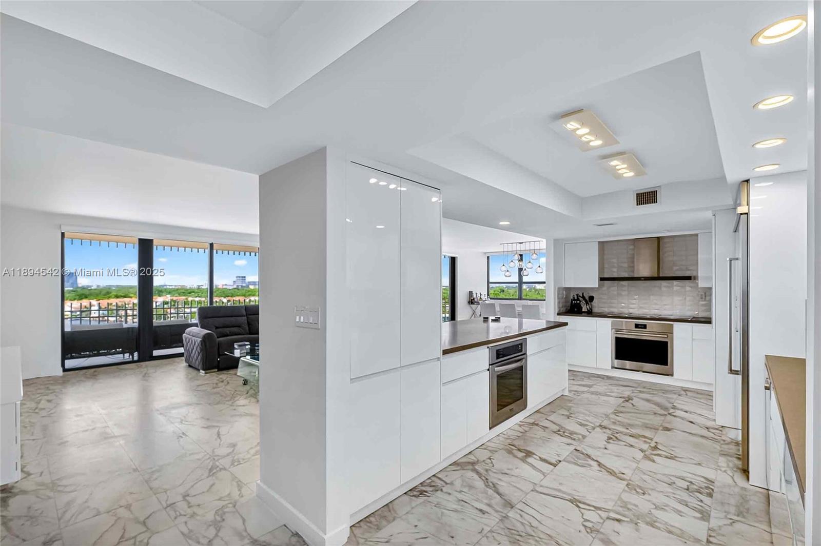 a kitchen with refrigerator cabinets and furniture