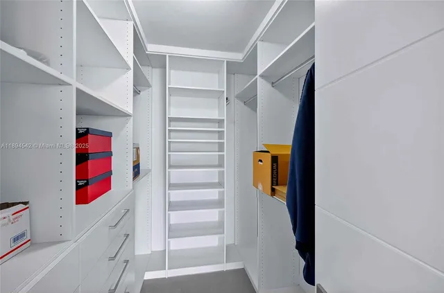 a living room with a large window and a couch