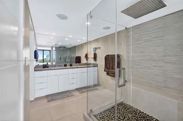 a bathroom with double vanity sinks double vanity and a mirror