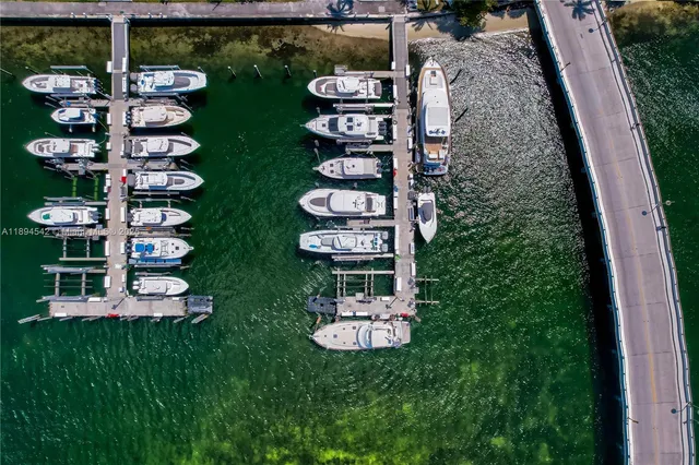 a view of a lake with a house and a garden