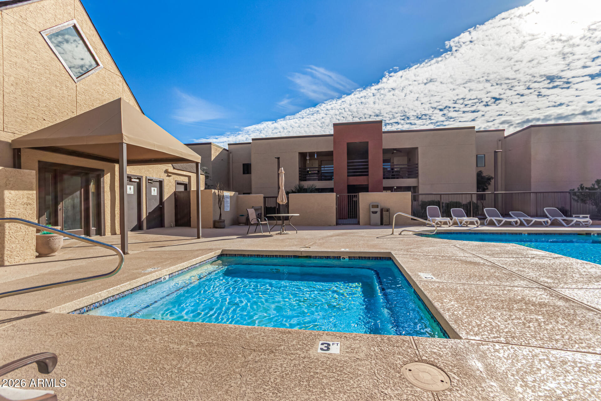 1340 North Recker Road, Unit 343 Mesa, AZ 85205 - Photo 24 of 28 a swimming pool with outdoor seating
