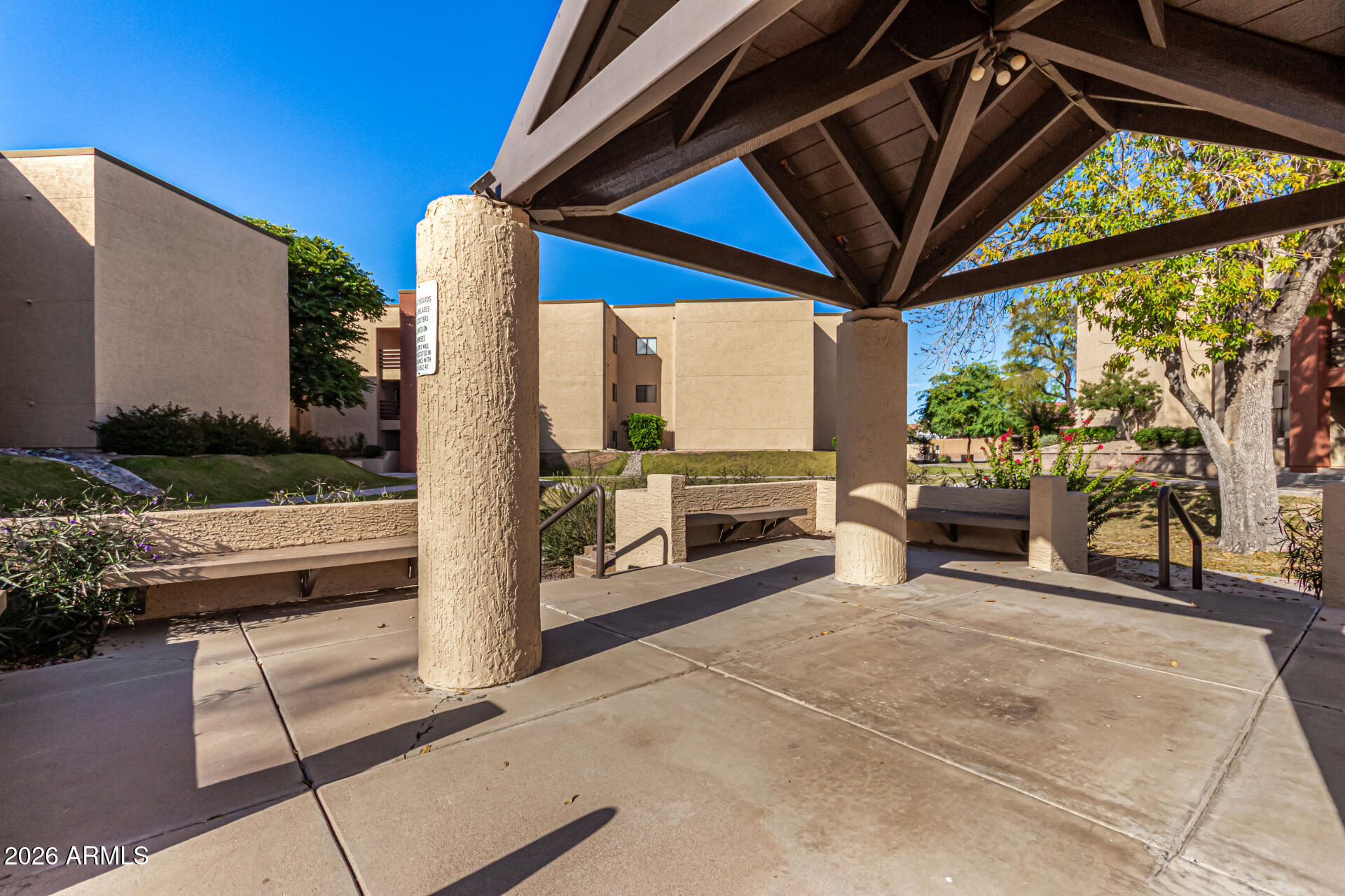 1340 North Recker Road, Unit 343 Mesa, AZ 85205 - Photo 27 of 28 a view of living room with patio furniture and a patio