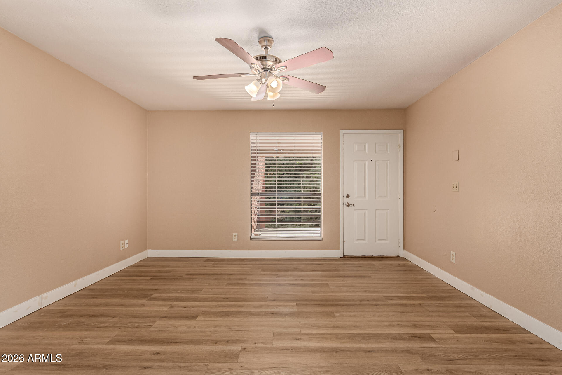 1340 North Recker Road, Unit 343 Mesa, AZ 85205 - Photo 2 of 28 wooden floor in an empty room with a window