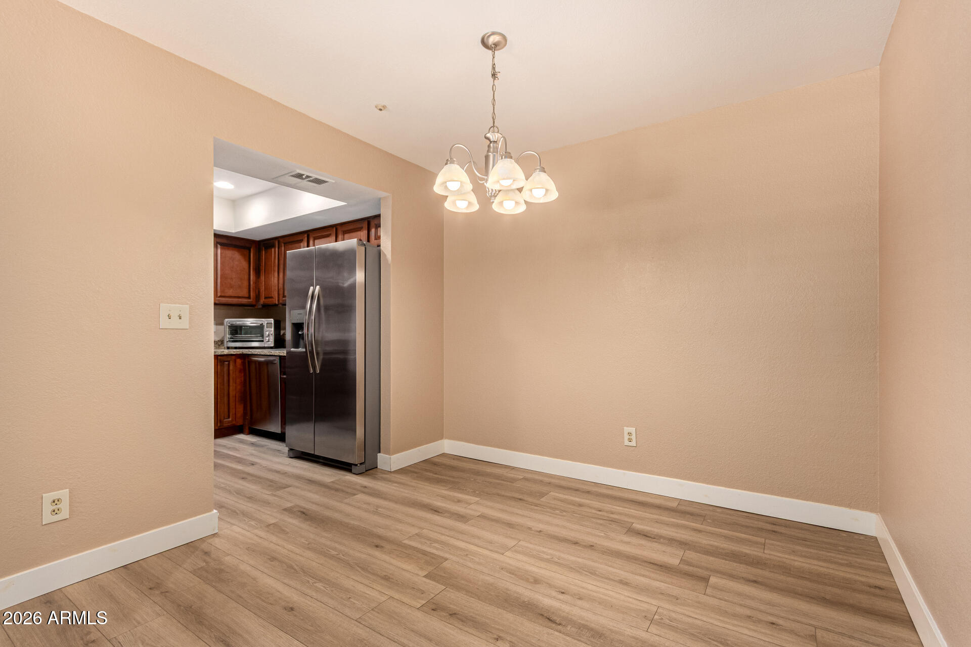 1340 North Recker Road, Unit 343 Mesa, AZ 85205 - Photo 8 of 28 a view of a kitchen with wooden floor and a kitchen