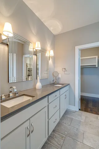a bathroom with a glass shower door