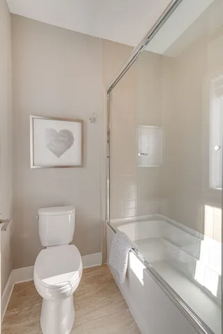 a bedroom with bed and window