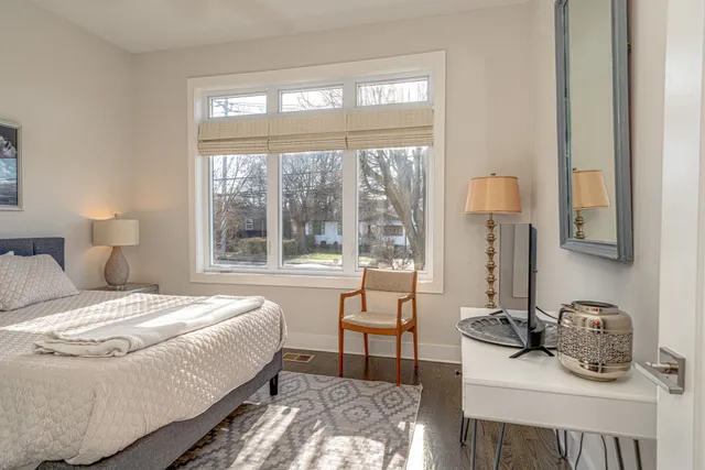 a bedroom with a bed and a tv on table