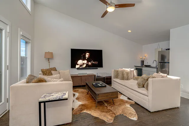 a living room with furniture and a window