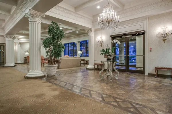 a view of a living room and chandelier