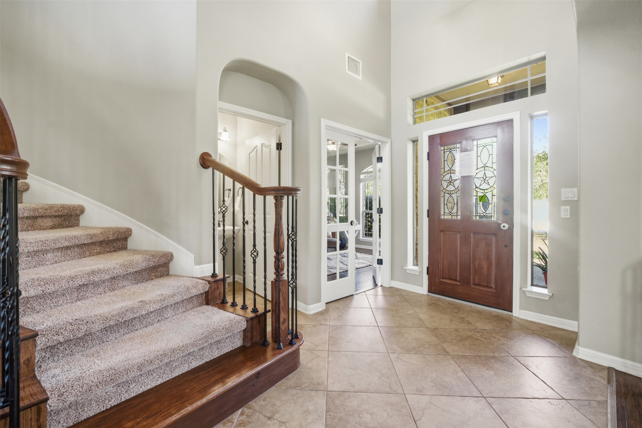 16100 Spillman Ranch Loop Austin, TX 78738 - Photo 5 of 39 Foyer with a high ceiling and light tile patterned floors