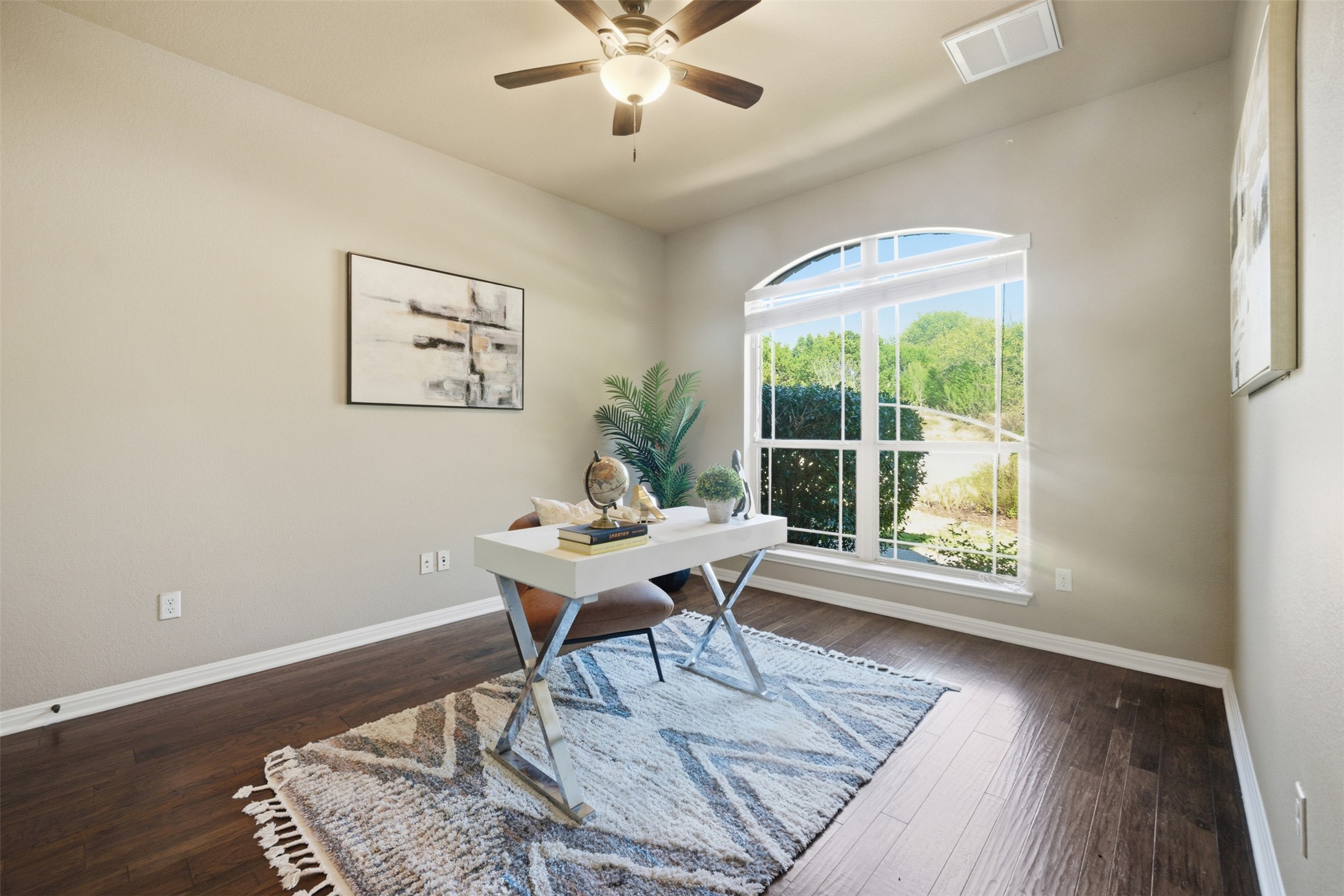 16100 Spillman Ranch Loop Austin, TX 78738 - Photo 6 of 39 Home office with ceiling fan and dark wood finished floors