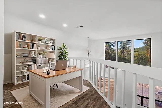 a view of a workspace with furniture