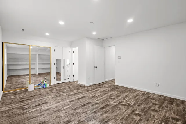 a view of a livingroom with wooden floor