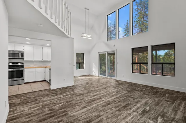 a view of an entryway with wooden floor and windows