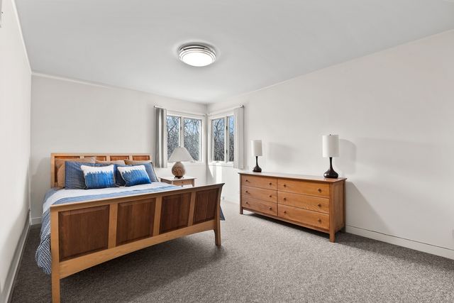 a bed room with furniture and a window