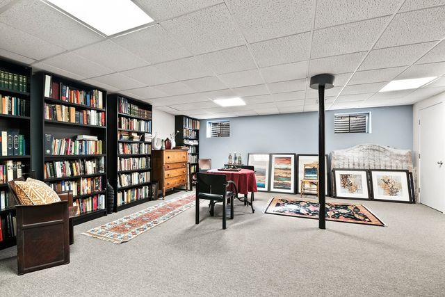a reading room with furniture and book shelf