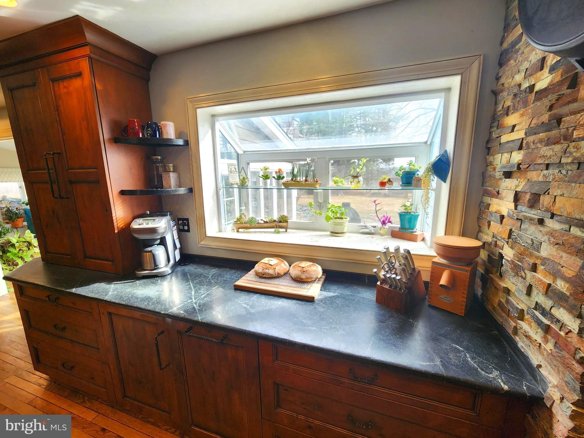 6774 Chapel Road New Hope, PA 18938 - Photo 11 of 59 a kitchen with stainless steel appliances granite countertop a sink dishwasher and a refrigerator with wooden floor