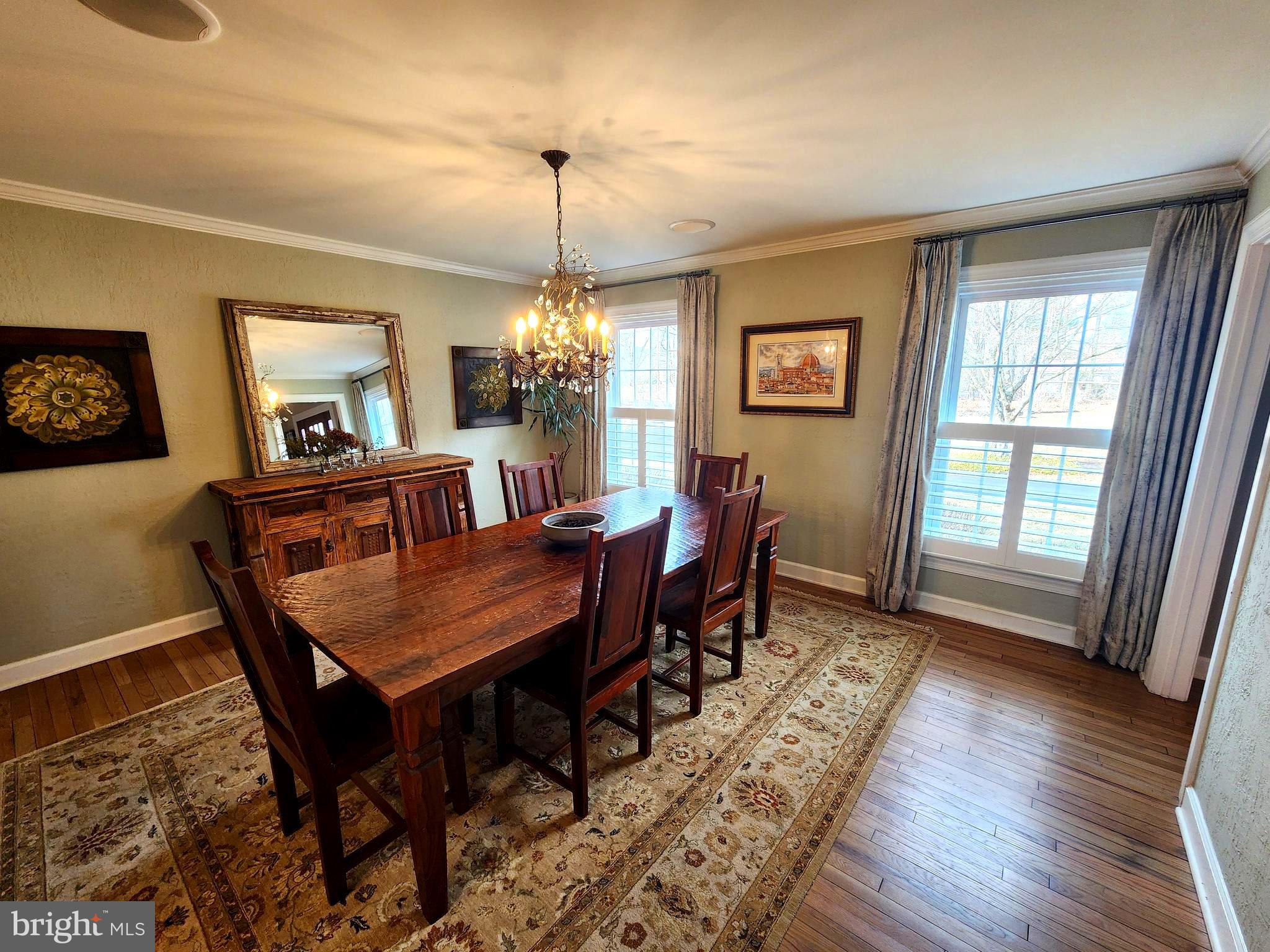 6774 Chapel Road New Hope, PA 18938 - Photo 14 of 59 a dining room with furniture a chandelier and wooden floor