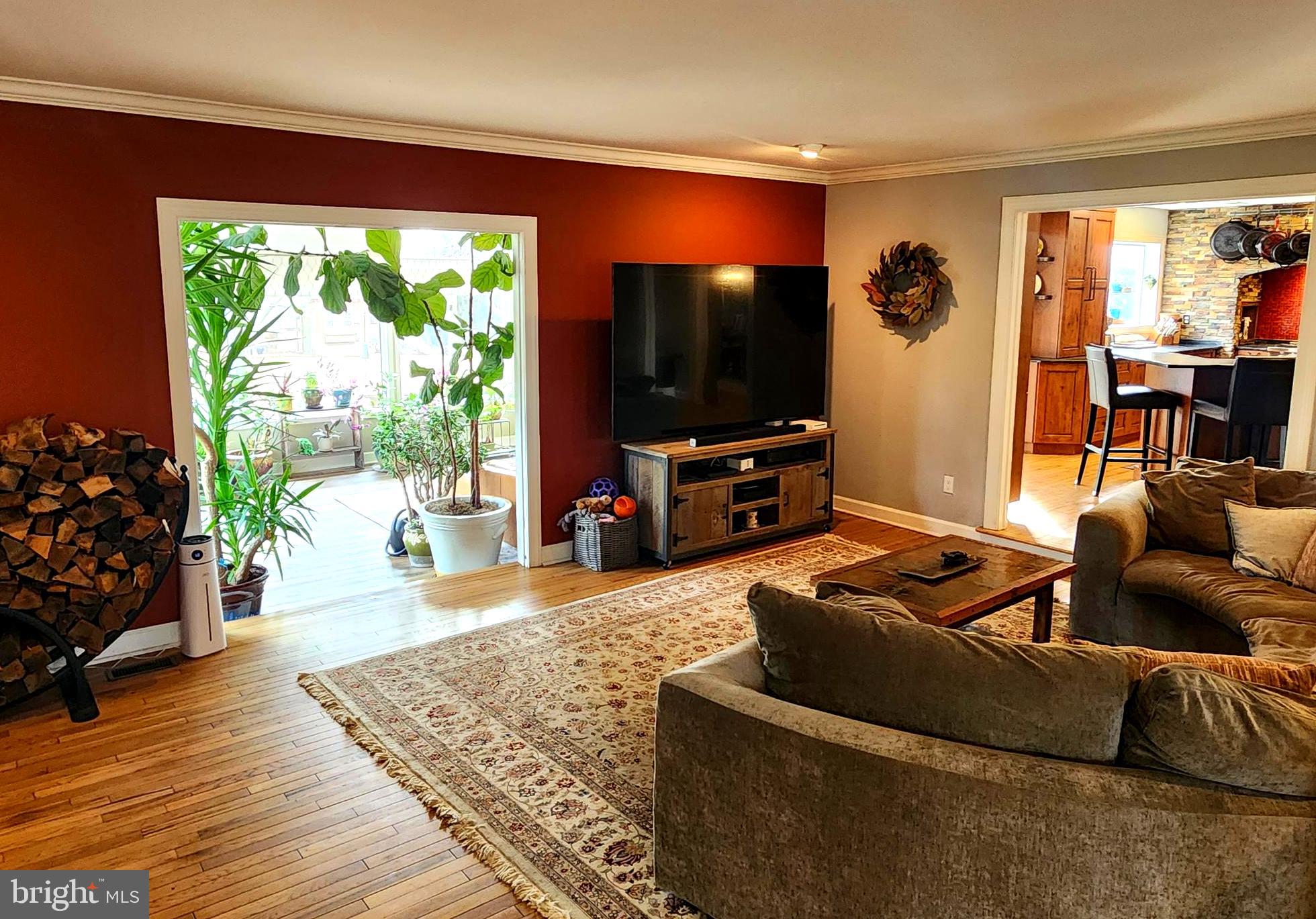6774 Chapel Road New Hope, PA 18938 - Photo 20 of 59 a living room with furniture a flat screen tv and a floor to ceiling window
