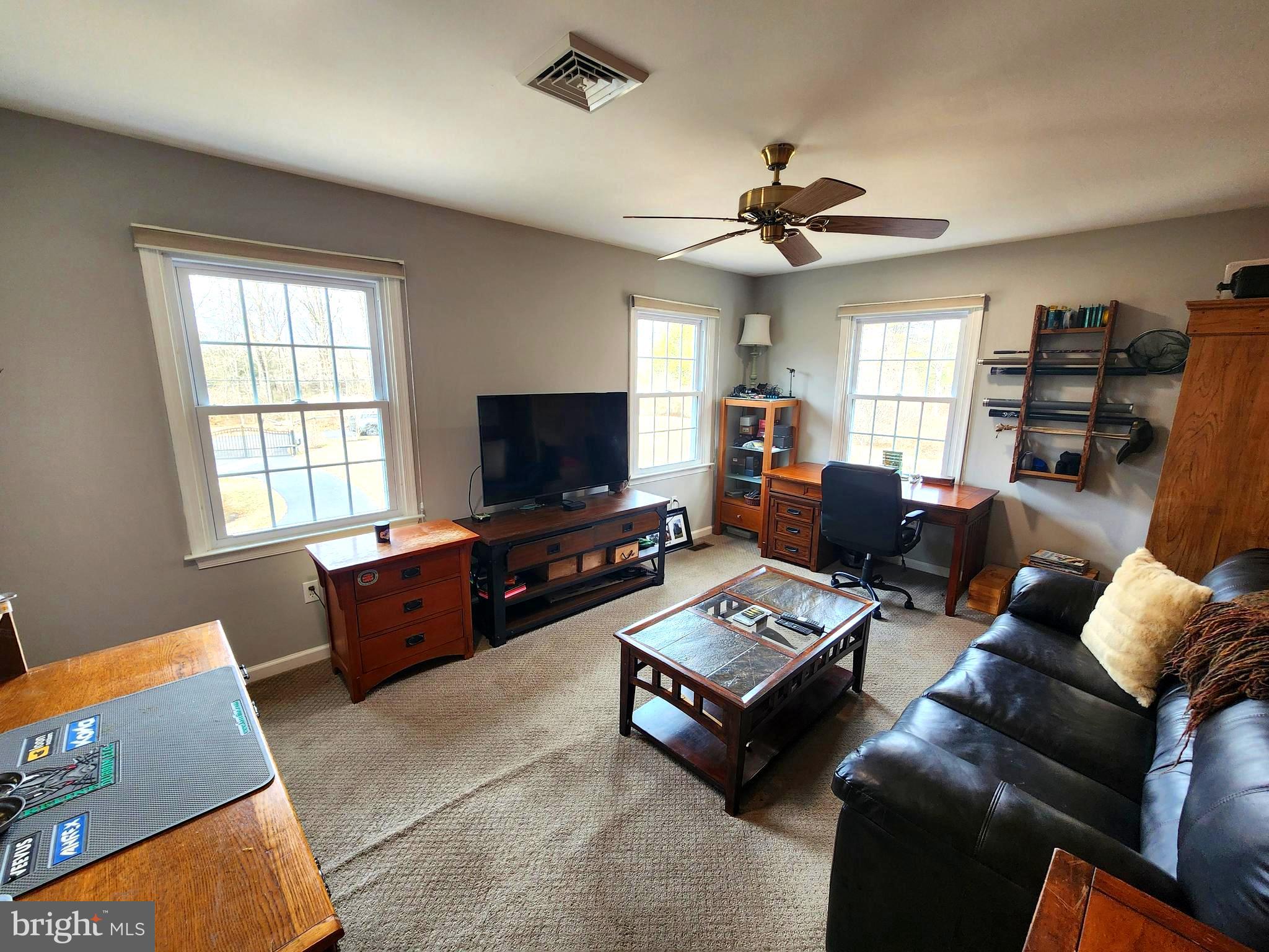 6774 Chapel Road New Hope, PA 18938 - Photo 37 of 59 a living room with furniture and a flat screen tv