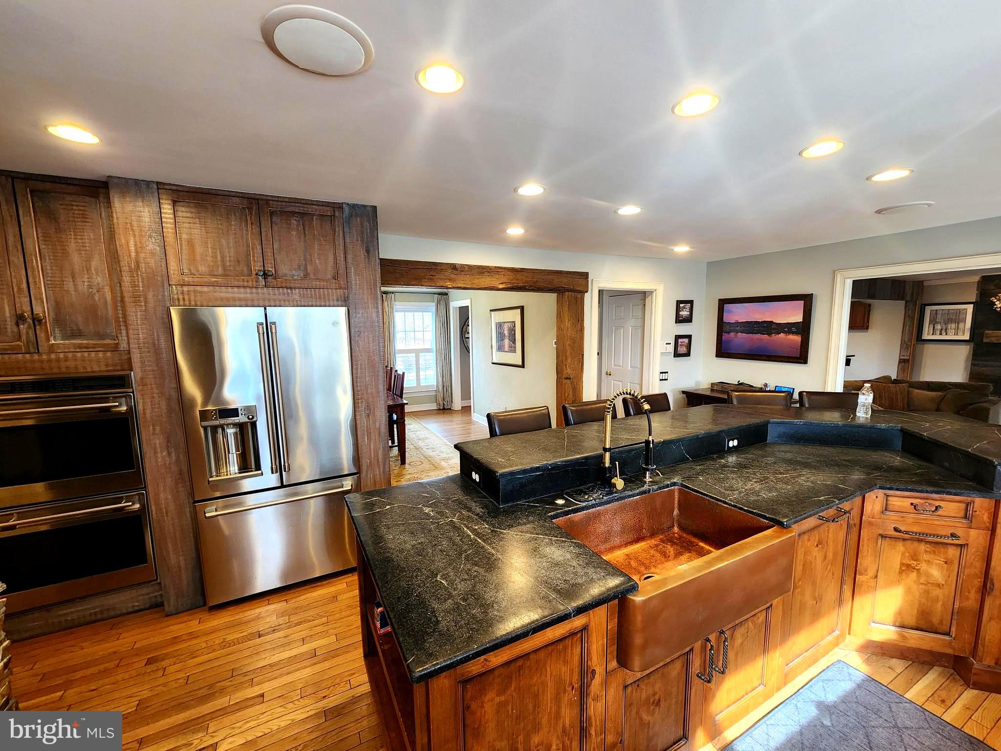 6774 Chapel Road New Hope, PA 18938 - Photo 7 of 59 a kitchen with stainless steel appliances granite countertop a refrigerator a stove and a sink