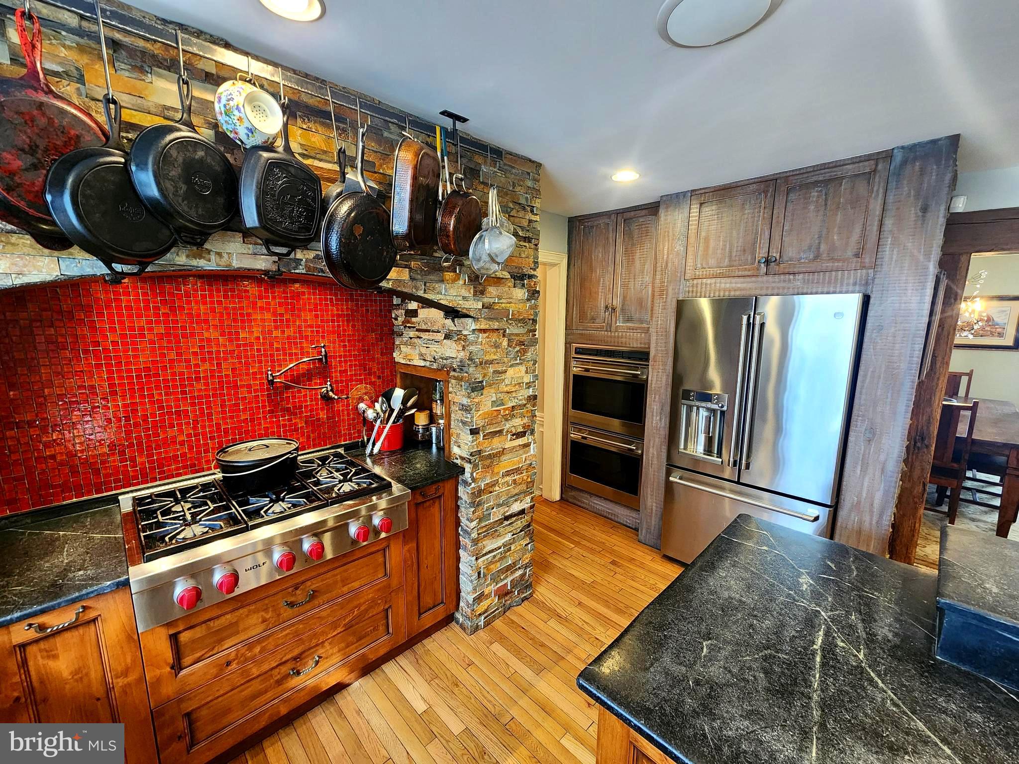 6774 Chapel Road New Hope, PA 18938 - Photo 9 of 59 a kitchen with stainless steel appliances a stove a refrigerator and a wooden cabinets