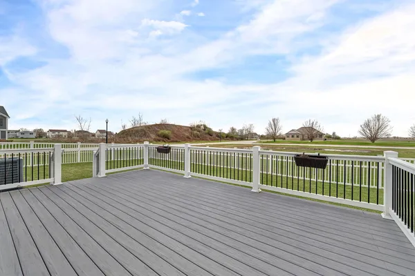 a view of a balcony with wooden floor