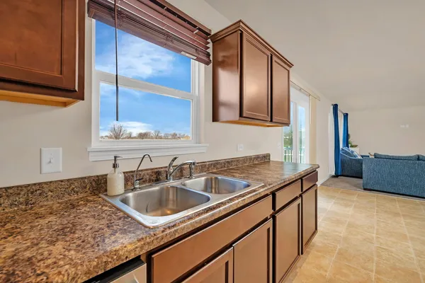 a kitchen with a sink and a window