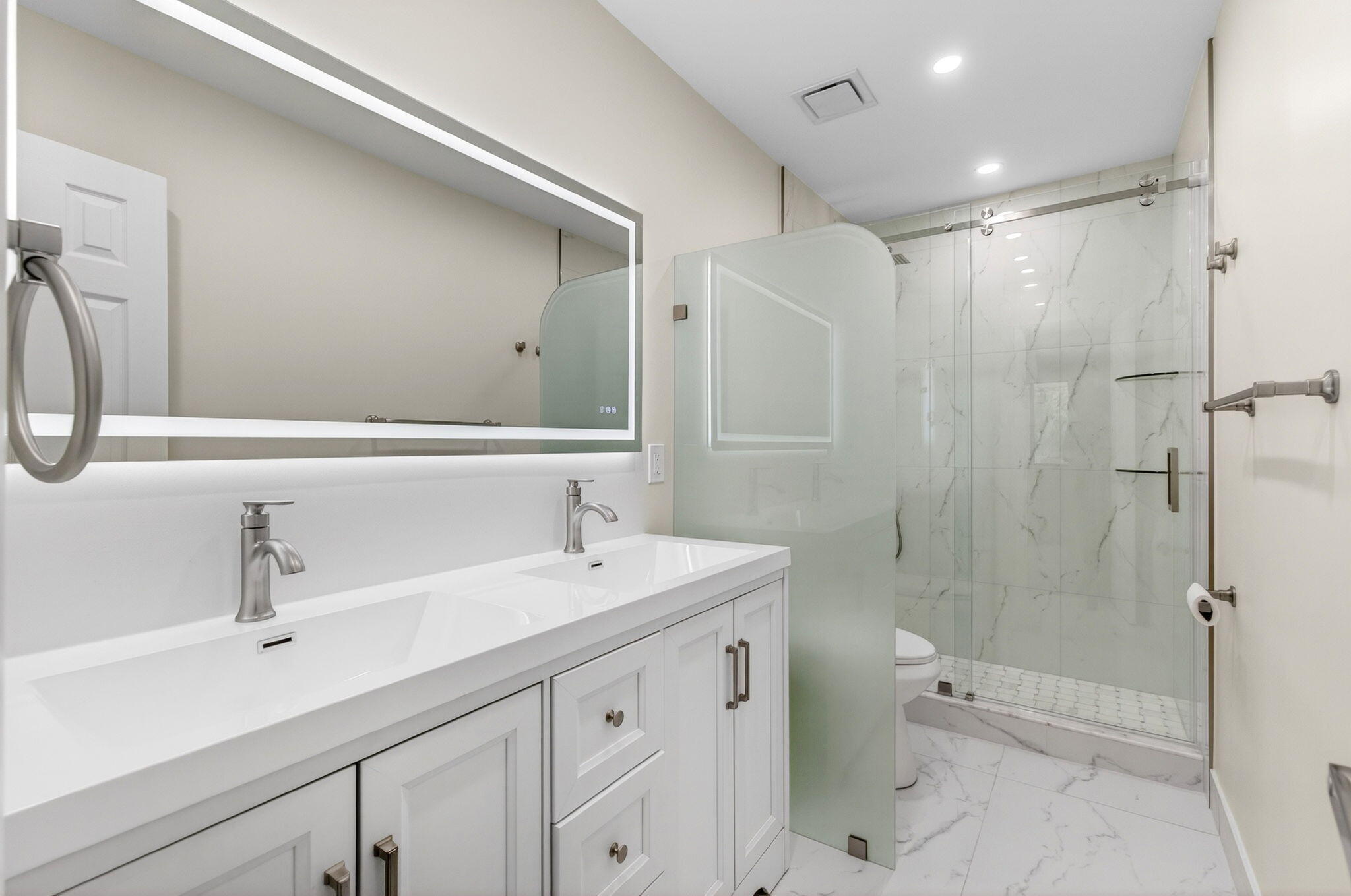 1330 Northwest 13th Street, Unit 12 Boca Raton, FL 33486 - Photo 26 of 52 a bathroom with a sink double vanity and shower