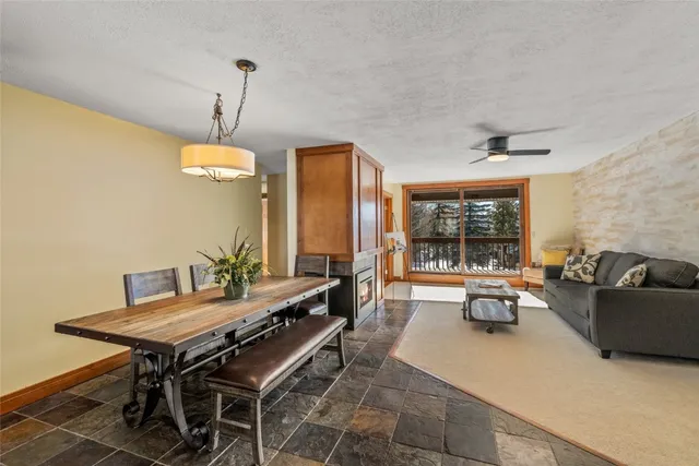 a kitchen with refrigerator and cabinets