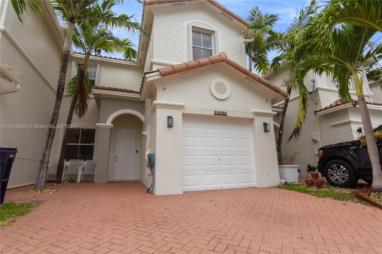 11051 Southwest 246th Street Homestead, FL 33032 - Photo 2 of 30 a view of a car park in front of house